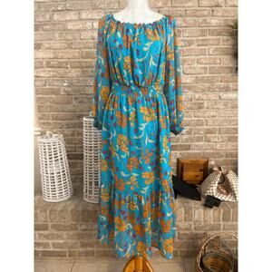 Sofia Vergara Blouson Sleeves in the Caneel Bay color and a floral pattern!